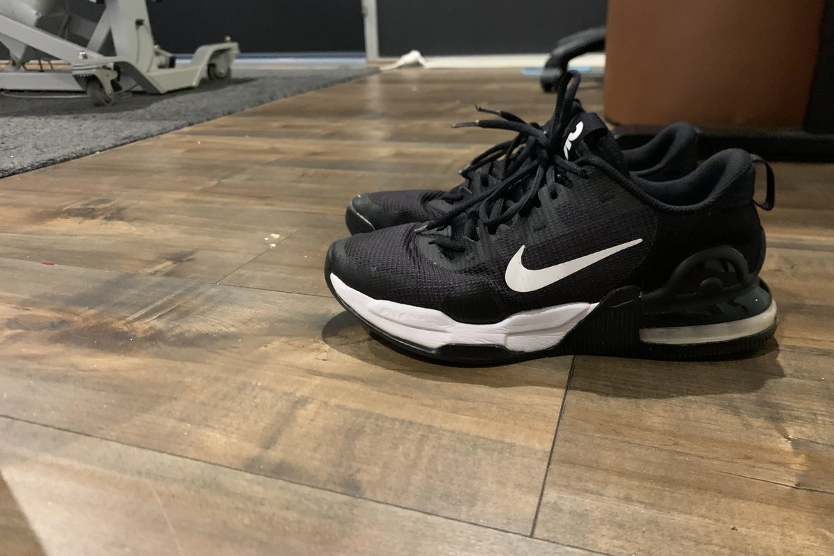 A worn pair of running shoes on the floor of the clinic